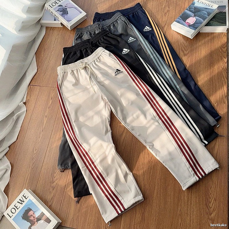 Adidas Three-Stripe Side Panels And An Easy Athletic Cut Striped Track Pants for daily