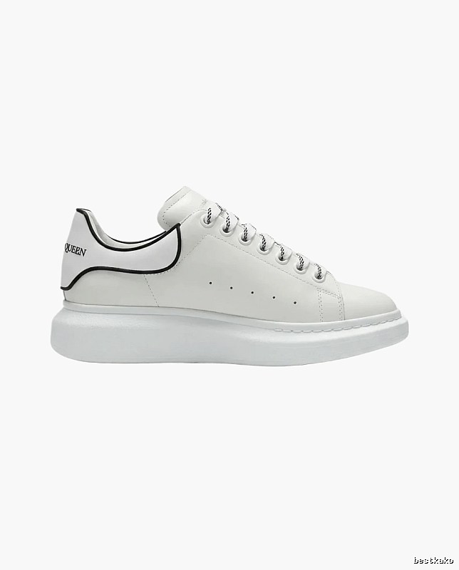The minimalist style of McQueen white sneakers.